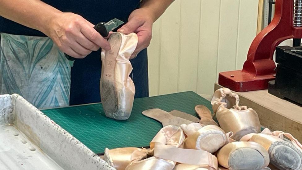 Rachel O'Connell has to first strip the leather out of the shoes before she can use it